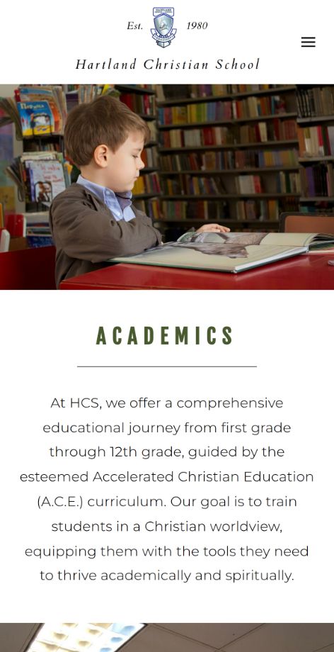 An interior page of the same site on a phone: the Academics page, with a photograph of a pupil reading and the section heading beneath it.